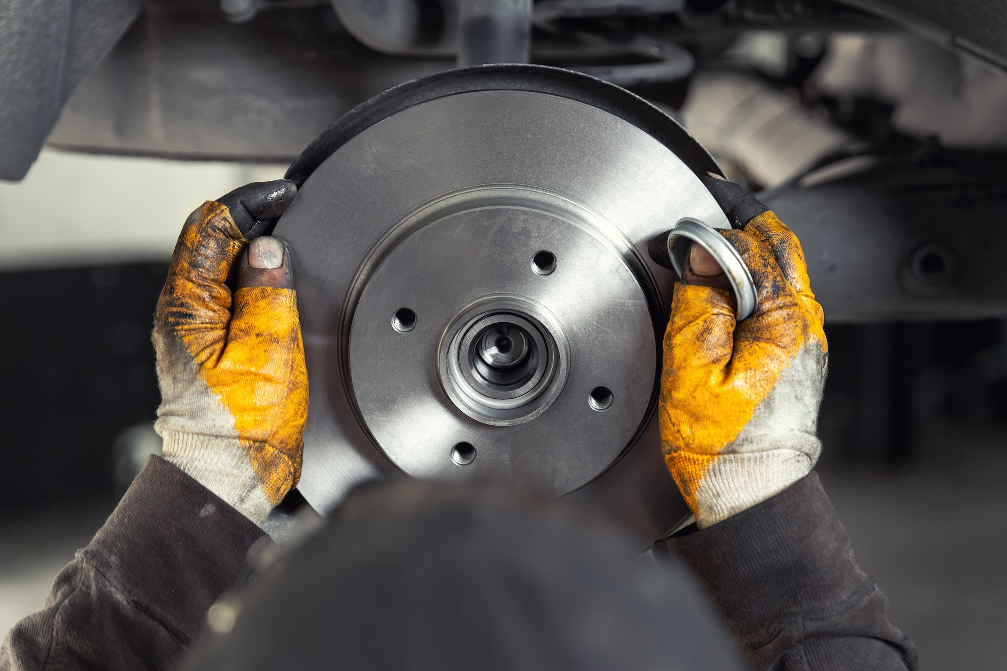 Mechanic fitting a new brake disc