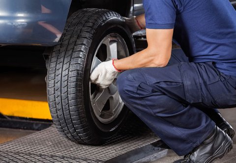 Mechanic changing a car tire