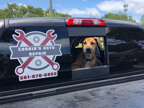 Corbin's Auto Repair service truck with the shop's crossed-wrench logo and phone number on the side